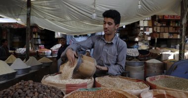 A Yemeni vendor displays types of imported grains for sale amid a food price spike at a market in the old city of Sanaa, Yemen, April 10, 2022. (EPA Photo)
