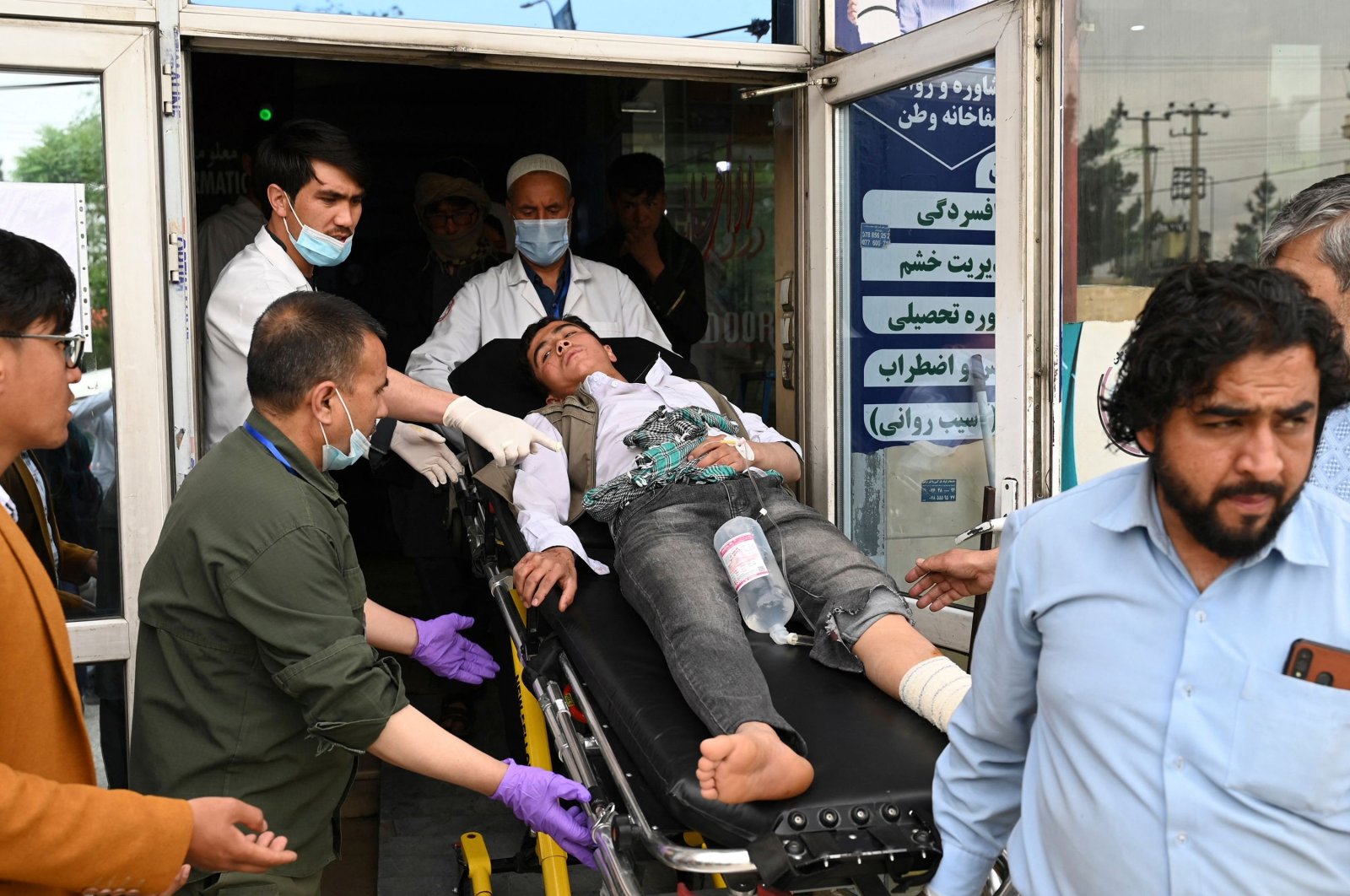 Medical staff move a wounded youth on a stretcher inside a hospital, Kabul, Afghanistan, April 19, 2022. (AFP Photo)