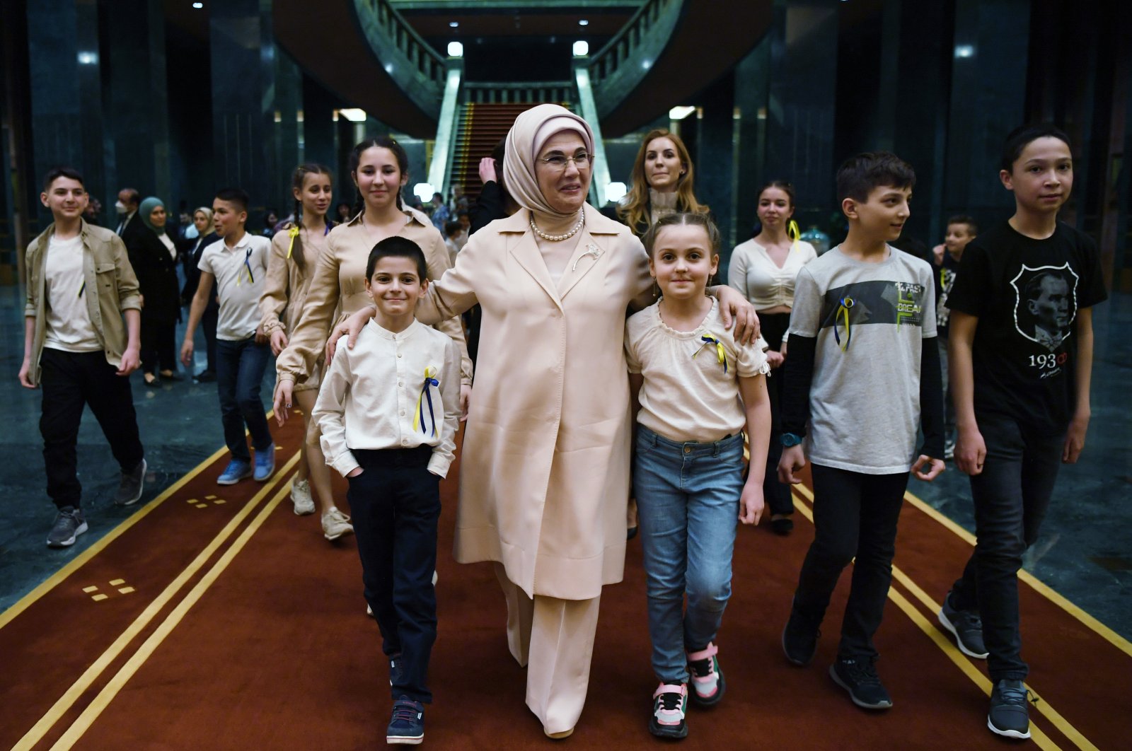 First lady Emine Erdoğan walks with Ukrainian children who sought refuge in Turkey during a dinner at the Presidential Complex in Ankara, Turkey, April 18, 2022. (AA Photo)