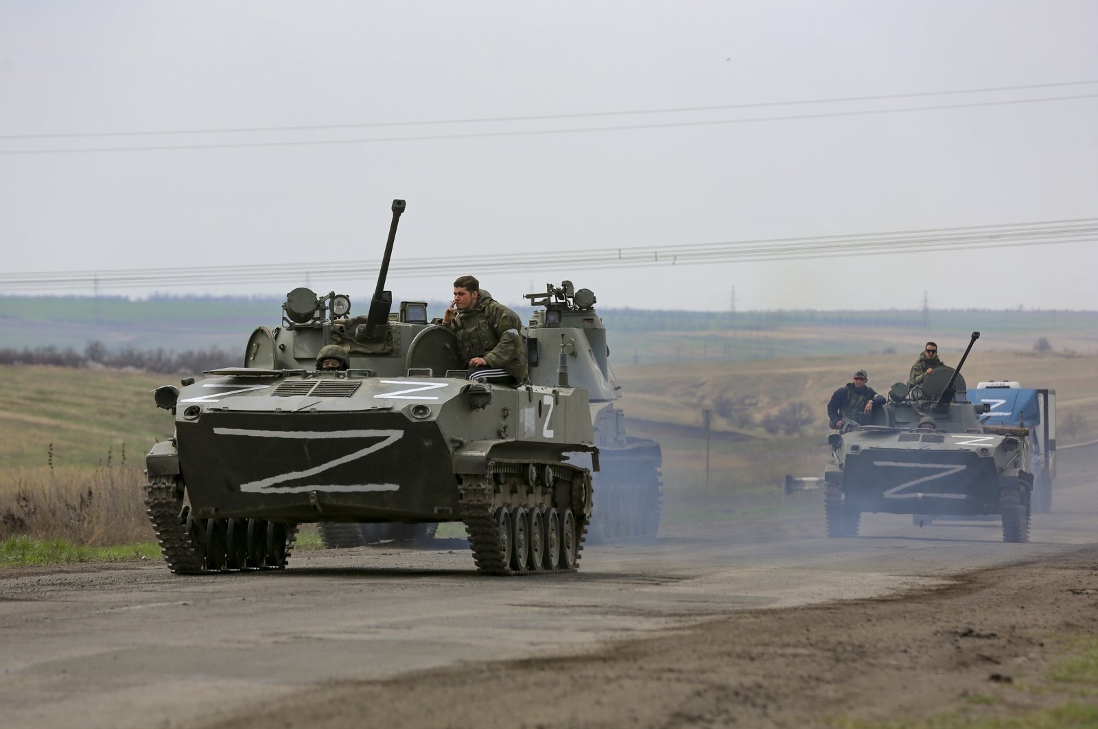 Russian military vehicles move on a highway in an area controlled by Russian-backed separatist forces near Mariupol, Ukraine, April 18, 2022. (AP Photo)