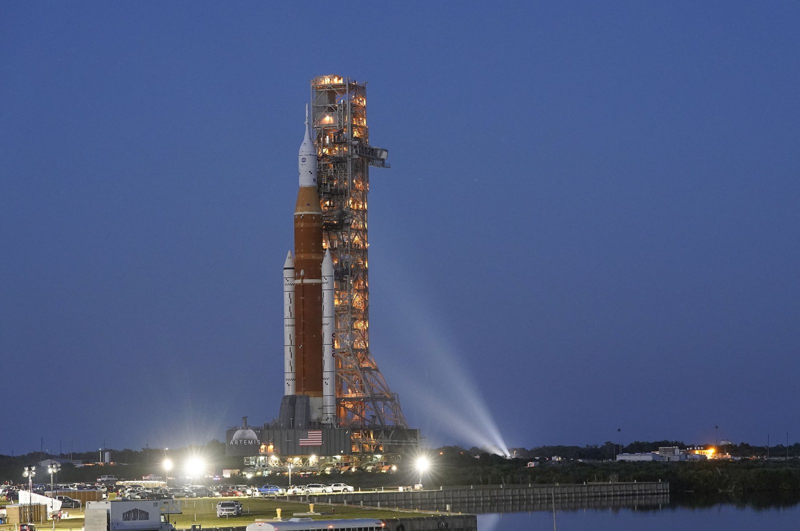 The NASA Artemis rocket with the Orion spacecraft aboard leaves the Vehicle Assembly Building moving slowly on an 11-hour journey to pad 39B at the Kennedy Space Center in Cape Canaveral, Florida, U.S., March 17, 2022. (AP Photo)