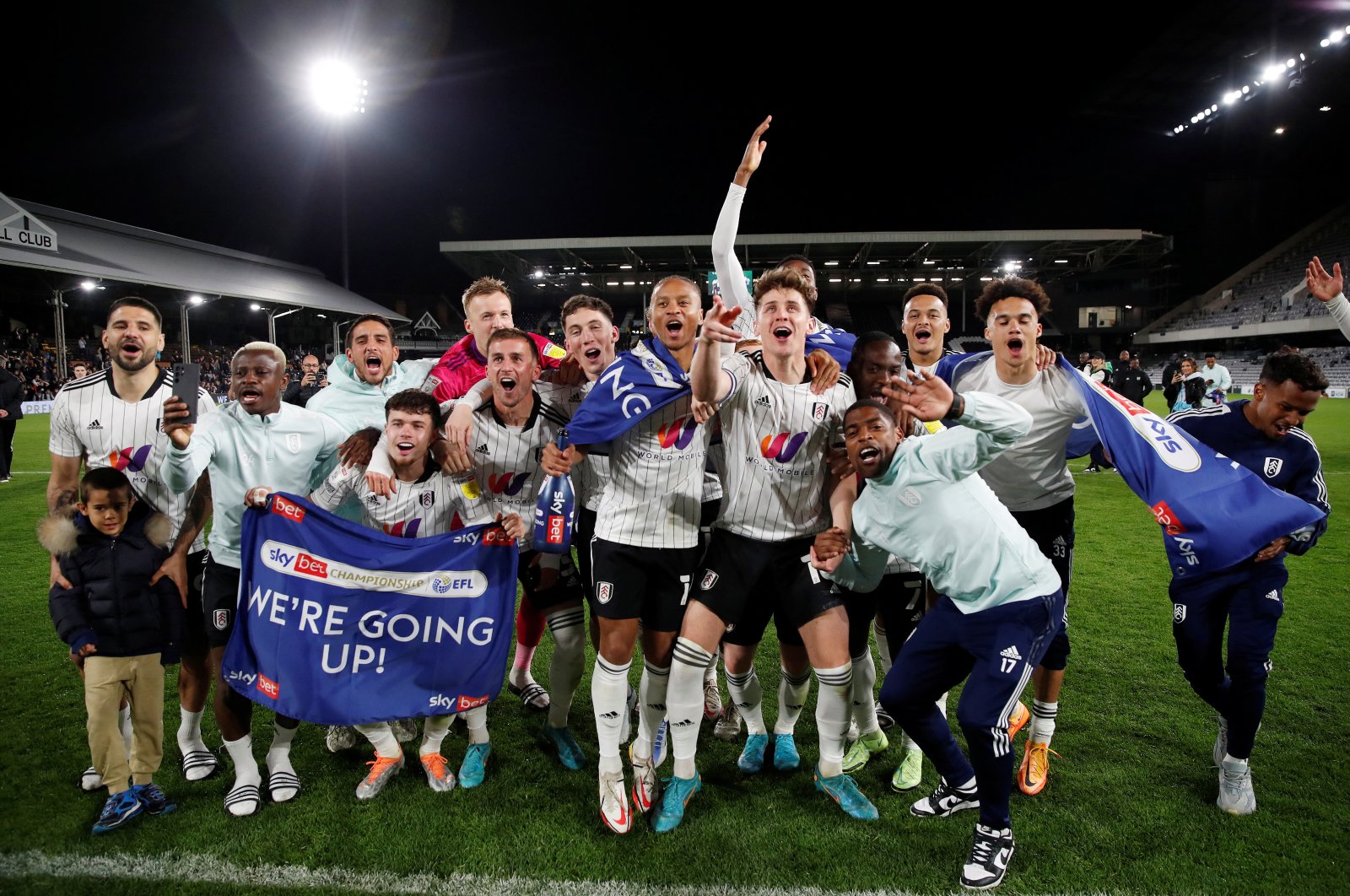 Fulham players celebrate after being promoted to the Premier League after a football match between Fulham and Preston North End at Craven Cottage, London, Britain, April 19, 2022. (Reuters Photo) 