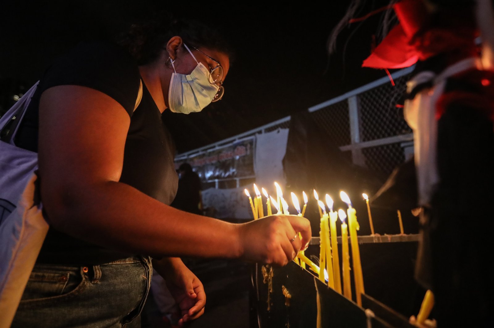 Protesters light candles in memory of the protester killed in a police shooting during the clash in Rambukkana, Colombo, Sri Lanka, April 19, 2022. (EPA Photo)