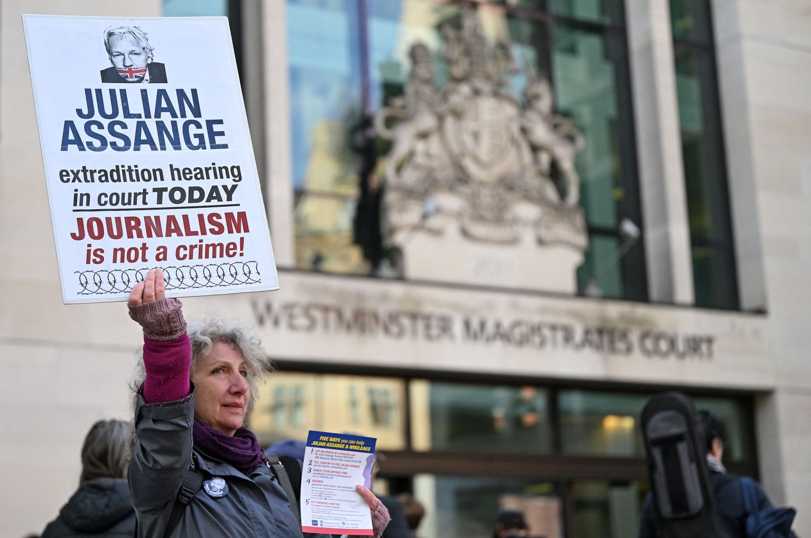 Supporters and activists hold placards outside Westminster Magistrates court calling for WikiLeaks founder Julian Assange to be freed, London, U.K., April 20, 2022. (AFP Photo)