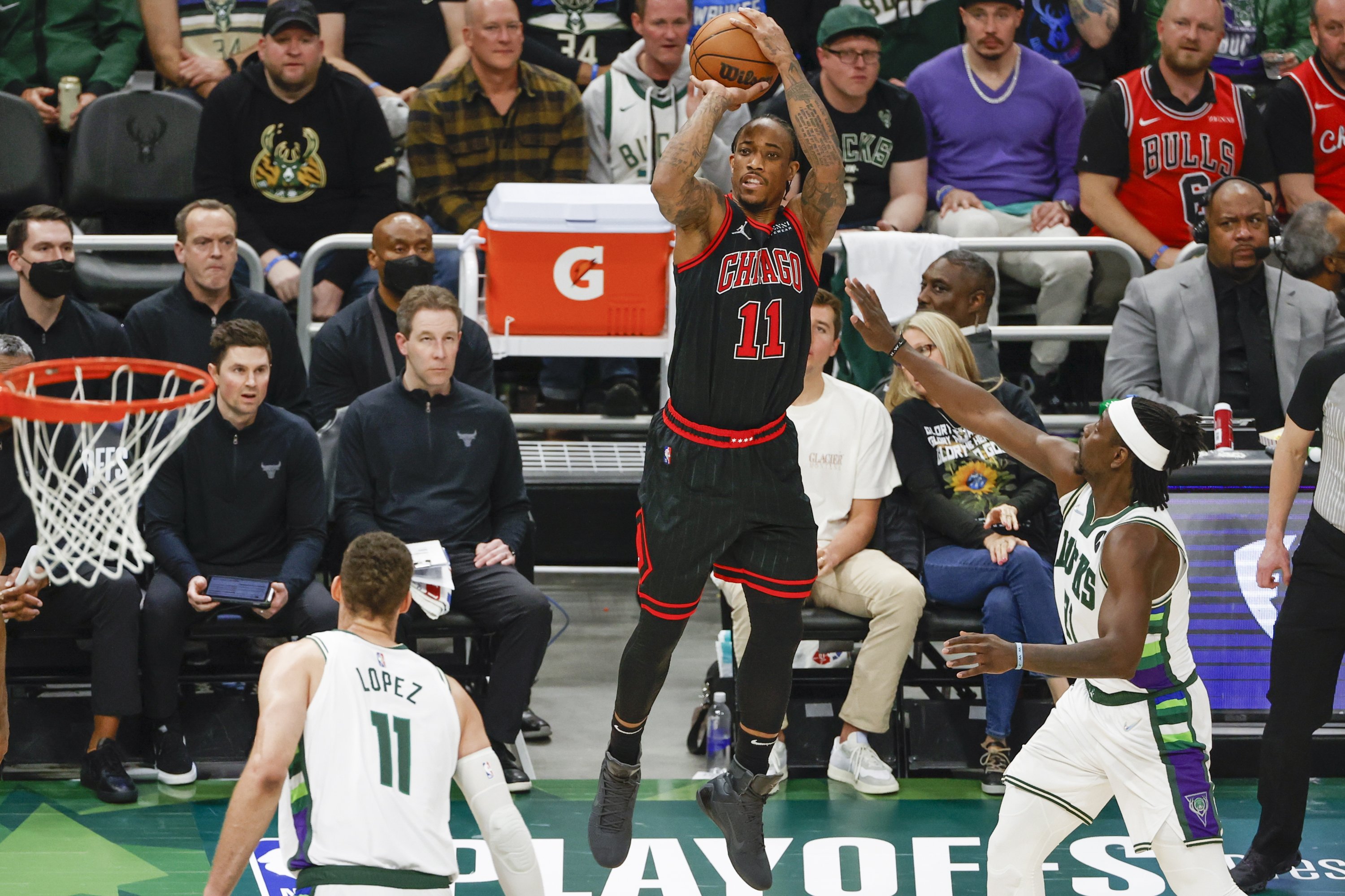 Bulls forward DeMar DeRozan (C) shoots against the Bucks in an NBA playoffs game, Milwaukee, Wisconsin, U.S., April 20, 2022. (EPA Photo)