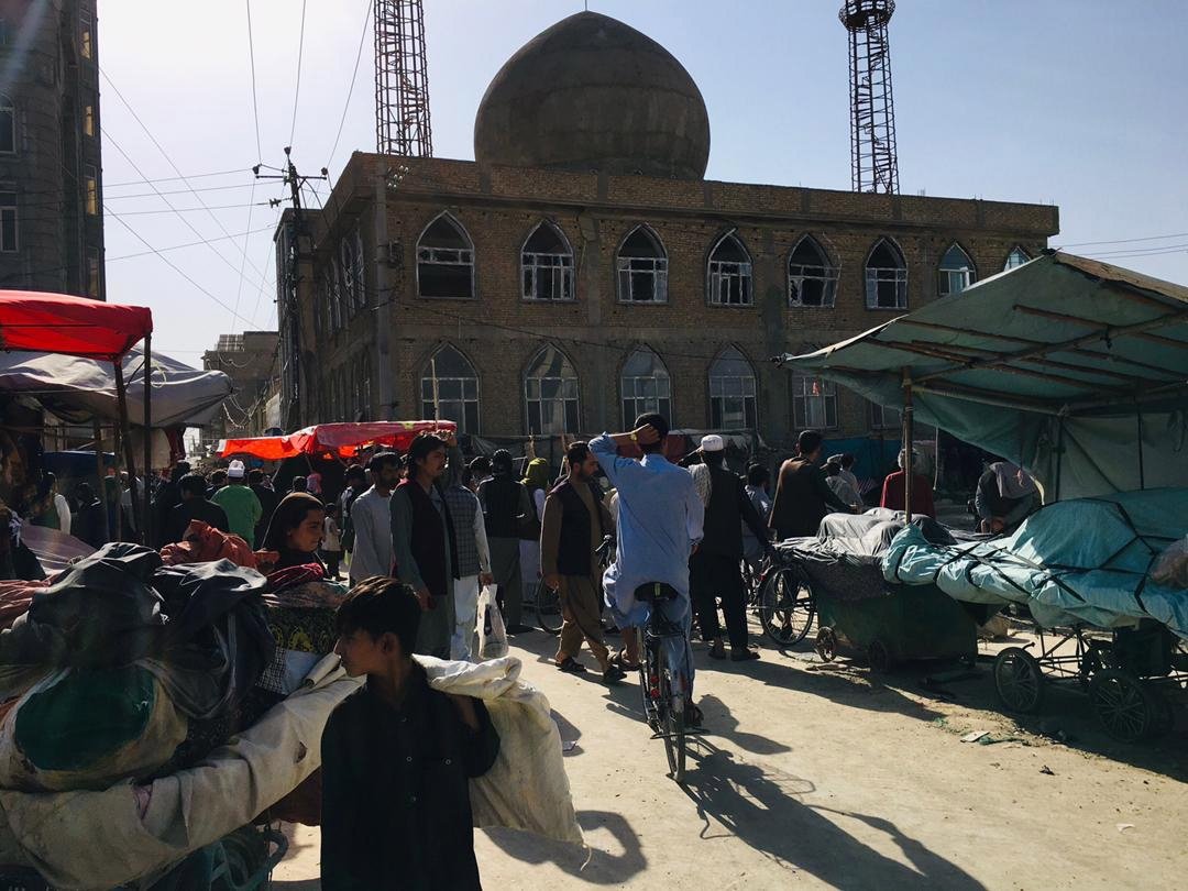 People gather outside a Shiite mosque following a blast in Mazar-e-Sharif, Afghanistan, April 21, 2022. (EPA Photo)