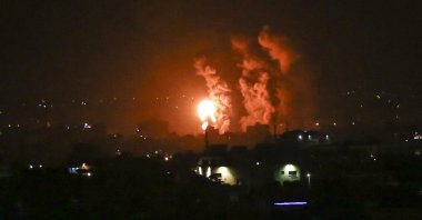 Flames and smoke rise during Israeli airstrikes on central Gaza Strip, April 21, 2022. (AFP Photo)