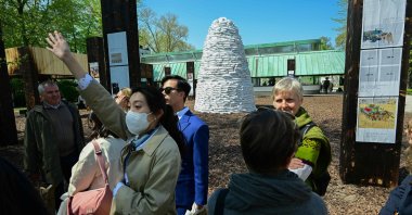 Visitors stand at the entrance of the Pavilion of Ukraine, during a press day at the 59th Venice Art Biennale, Venice, Italy, April 20, 2022. (AP Photo)