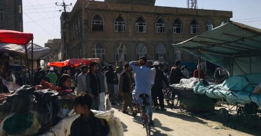 People gather outside a Shiite mosque following a blast in Mazar-e-Sharif, Afghanistan, April 21, 2022. (EPA Photo)