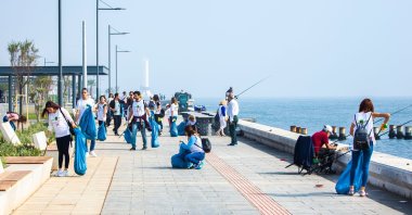 Earth Day is great celebrate habits to save the world like picking up trash as these young activists and environmentalists did, in Izmir, Turkey, Oct. 20, 2019. (Shutterstock Photo)