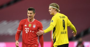 Bayern Munich's Robert Lewandowski (L) and Borussia Dortmund's Erling Braut Haaland react during a Bundesliga match at the Allianz Arena, in Munich, Germany, March 6, 2021. (Reuters Photo)
