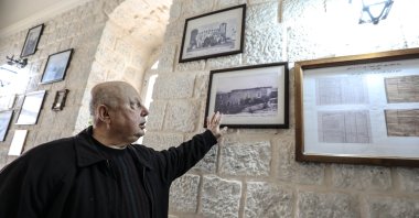 Hanna Celluf, the archpriest of Qunayah Church, speaks to Anadolu Agency, in Idlib province, Syria, April 21, 2022. (AA Photo)