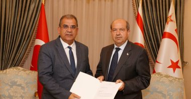 Turkish Republic of Northern Cyprus President Ersin Tatar (R) gives the mandate to form government to Faiz Sucuoğlu, Lefkoşa (Nicosia), Turkish Cyprus, April 22, 2022. (AA Photo)