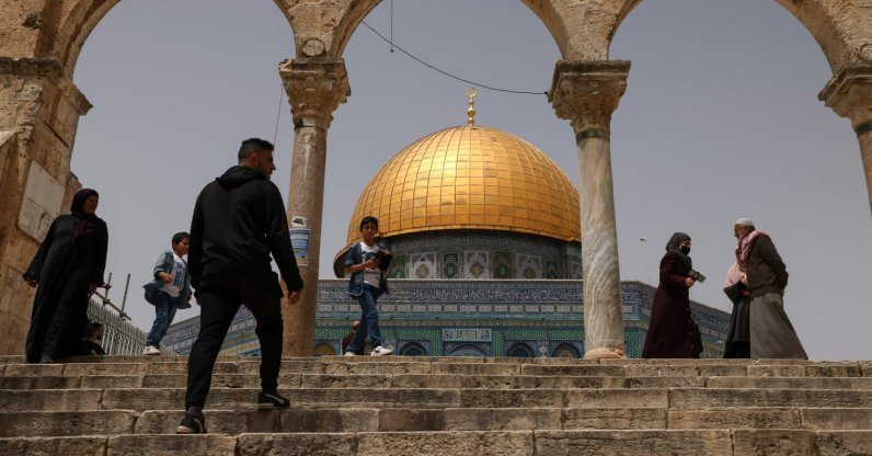 Palestinian Muslims gather in front of the Dome of Rock at the Al-Aqsa Mosque compound in the Old City, East Jerusalem, occupied Palestine, April 17, 2022. (AFP Photo)