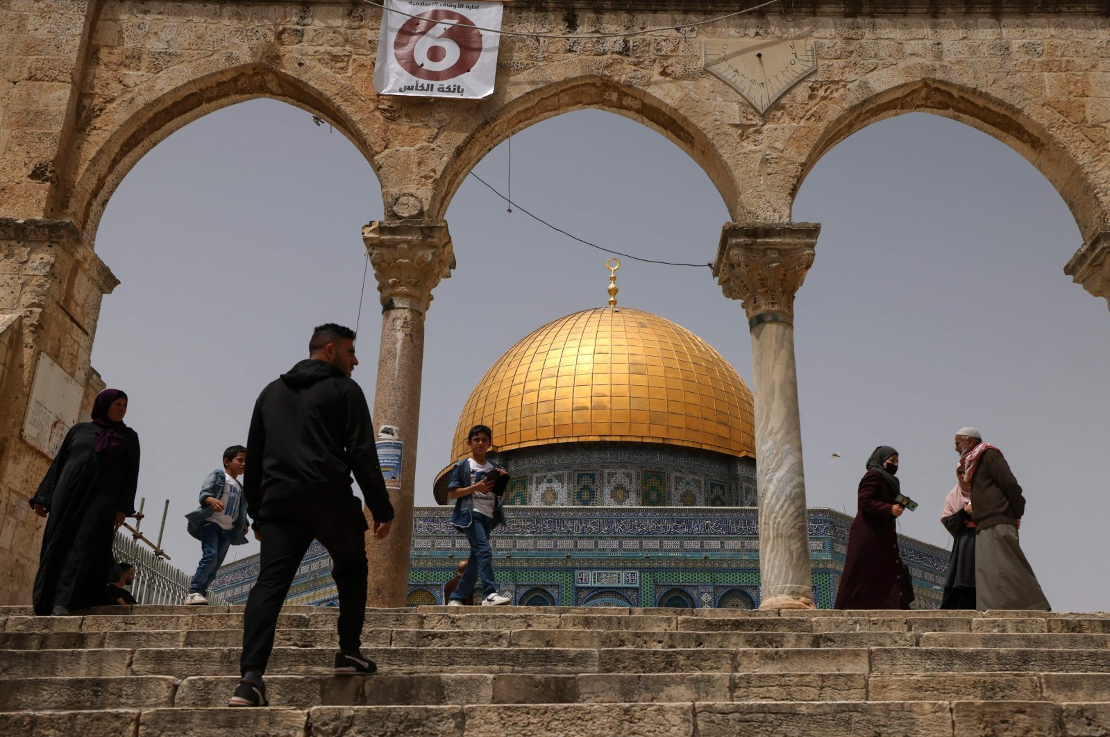 Palestinian Muslims gather in front of the Dome of Rock at the Al-Aqsa Mosque compound in the Old City, East Jerusalem, occupied Palestine, April 17, 2022. (AFP Photo)