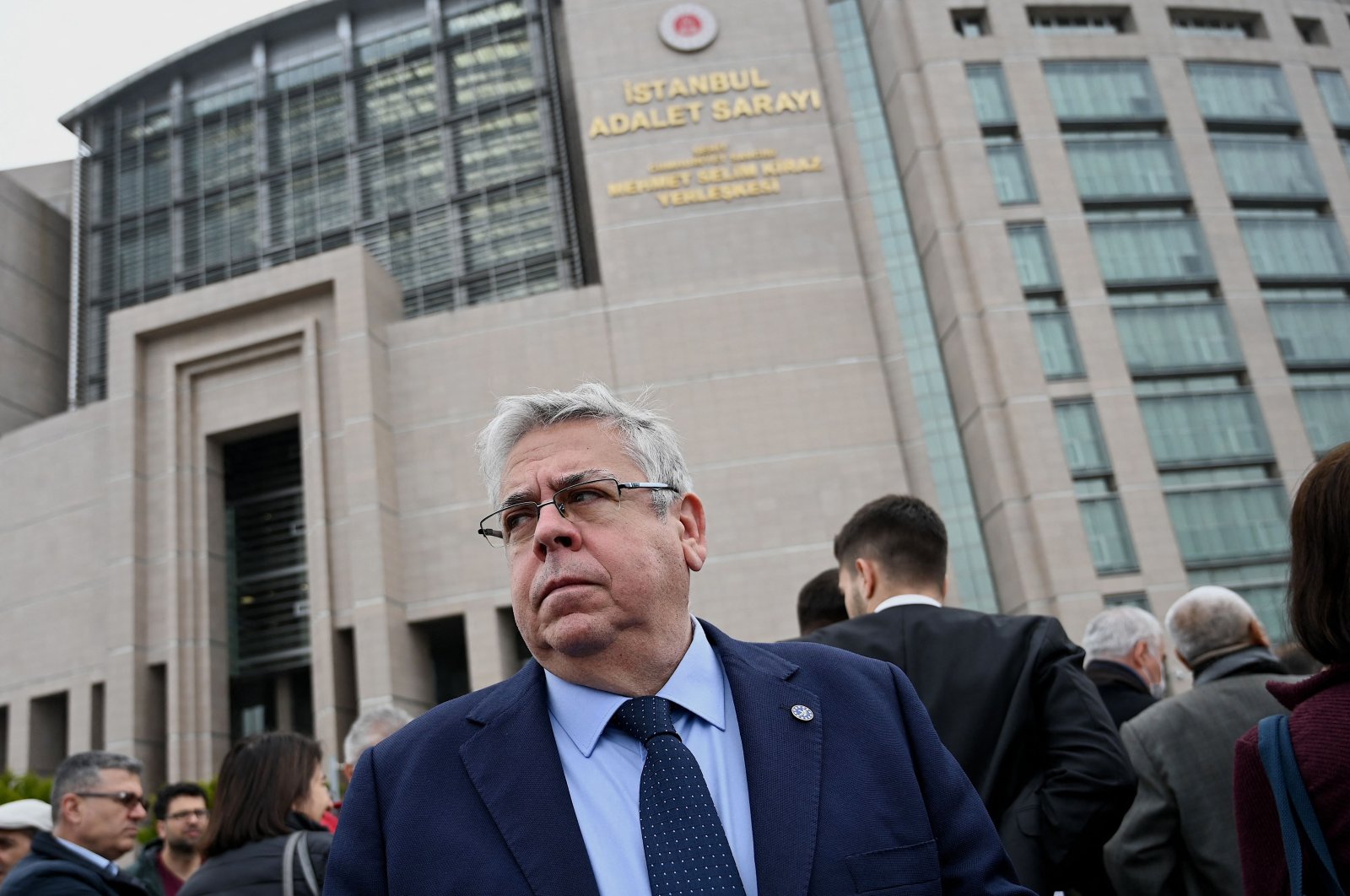European Parliament Turkey rapporteur Nacho Sanchez Amor stands in front of the Istanbul courthouse as demonstrators including lawyers and opposition lawmakers gather in support of Osman Kavala in Istanbul, on April 22, 2022. (AFP)