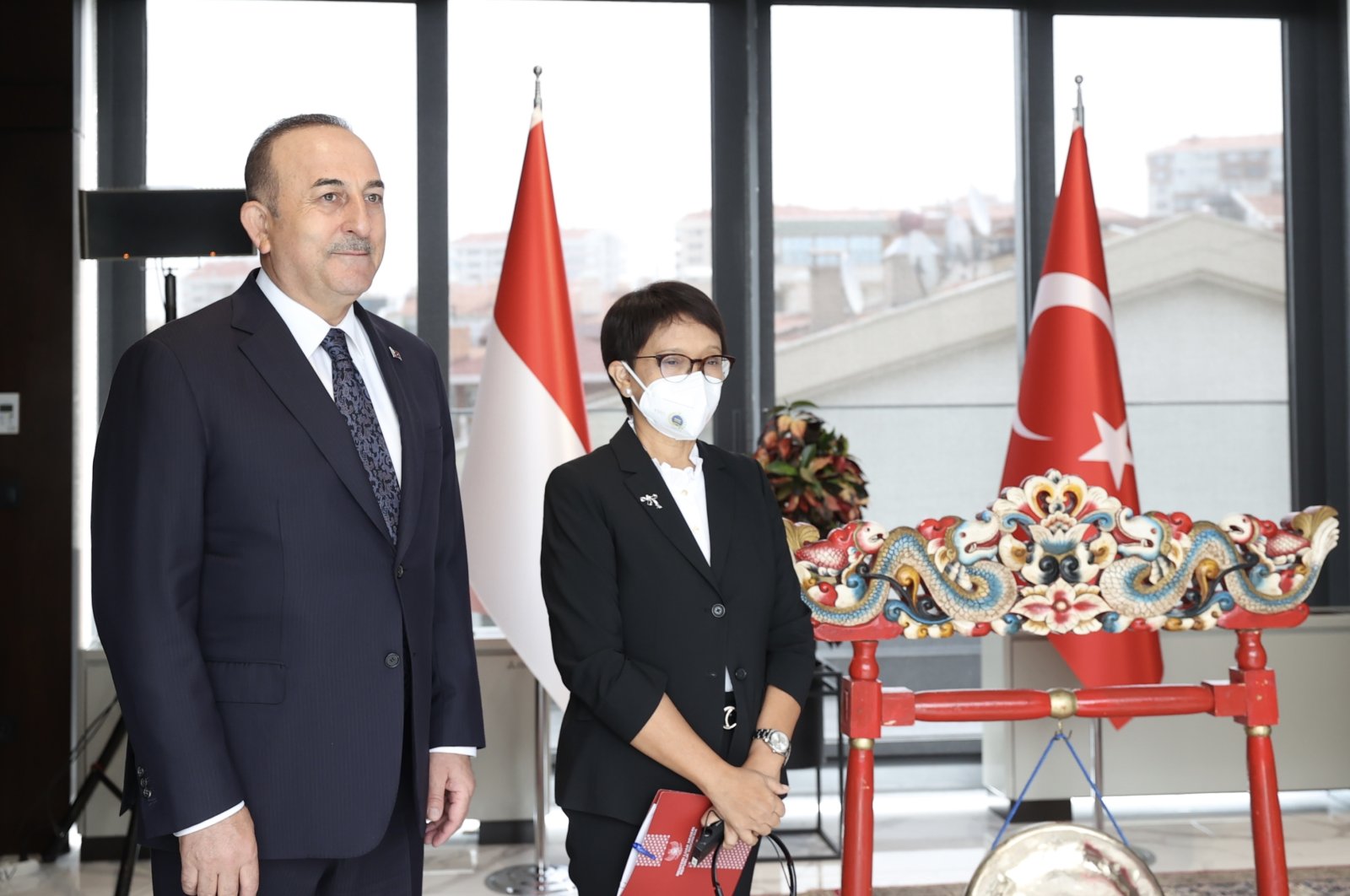 Foreign Minister Mevlüt Çavuşoğlu and his Indonesian counterpart Retno Marsudi pose during the inauguration ceremony of the new Indonesian Embassy building in Ankara, Turkey, April 22, 2022. (AA Photo)