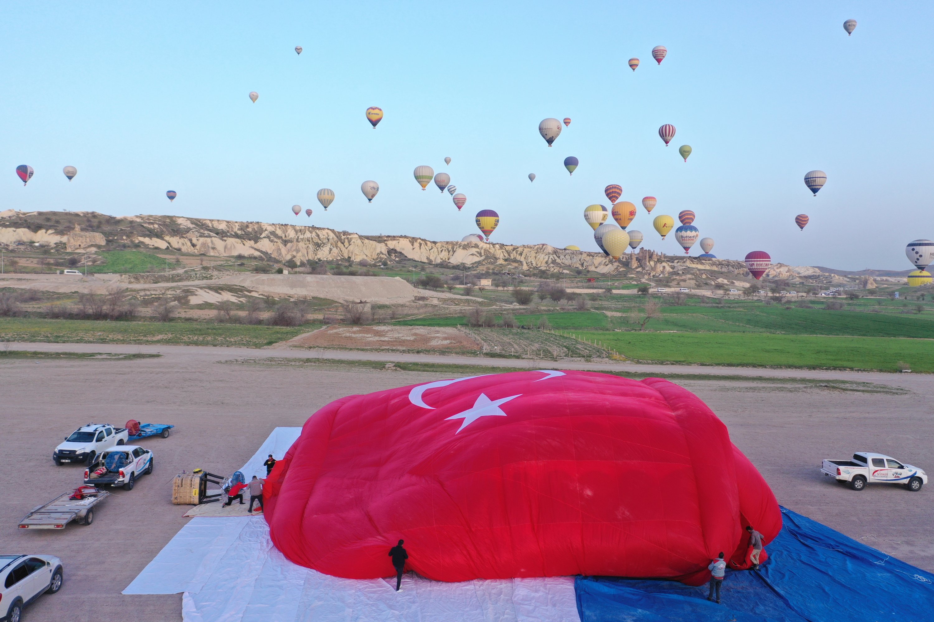 Turkish flag shaped hot balloon rises to the sky, Göreme, Cappadocia, Turkey, April 23, 2022. (AA Photo)