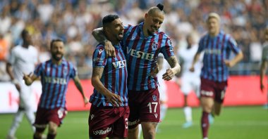 Trabzonspor's Bruno Peres (L) celebrates with teammate Marek Hamsik after scoring a goal in a Süper Lig match against Adana Demirspor, Adana, Turkey, April 23, 2022. (AA Photo)