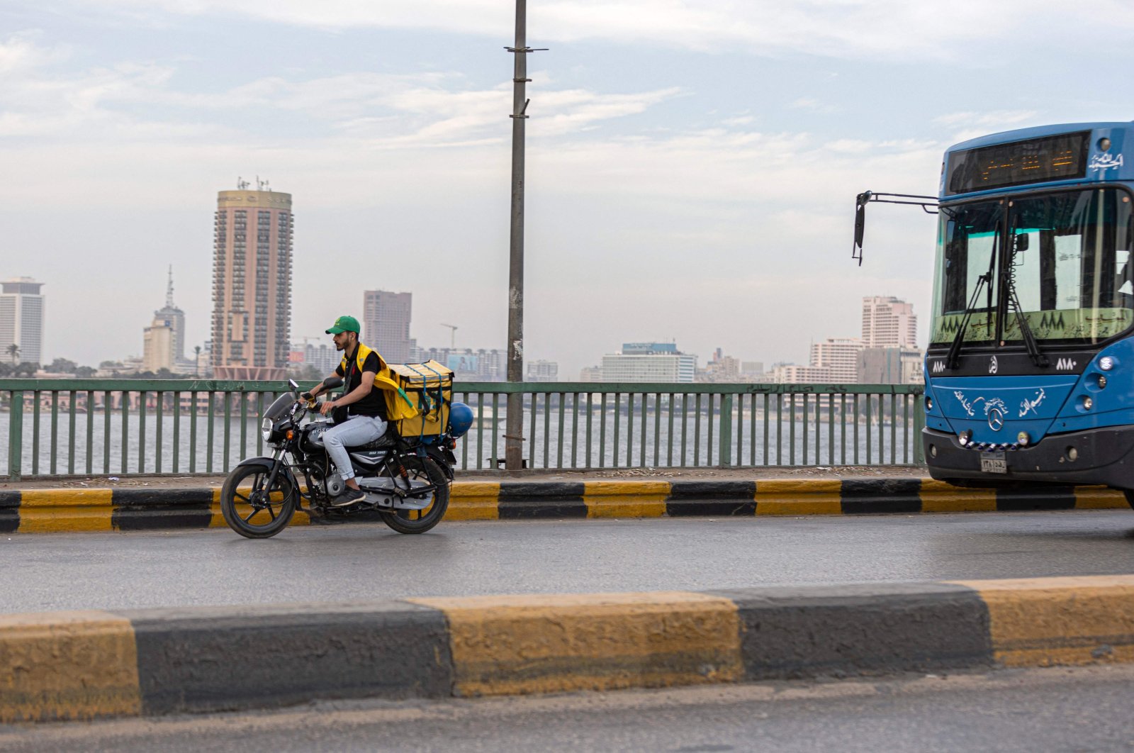 A delivery worker rides his motorbike in the capital Cairo, Egypt, April 21, 2022. (AFP Photo)