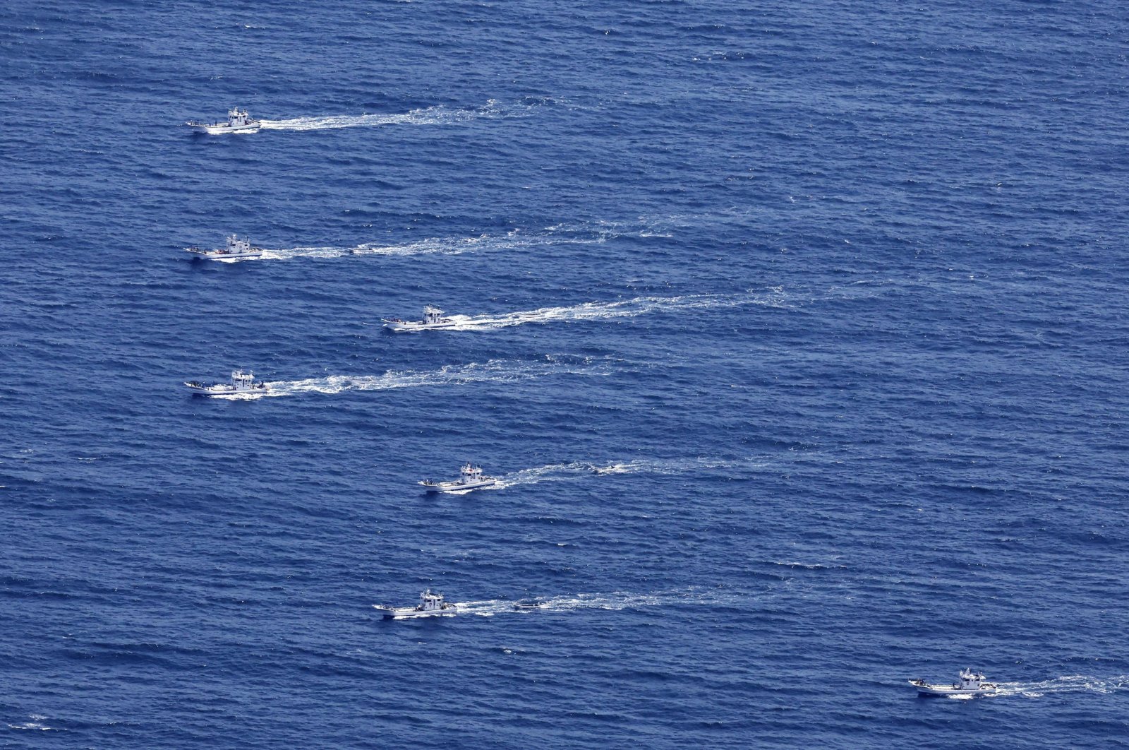This aerial photo shows the fishing boats conduct search operations for the passengers and crew members on a missing tour boat, off Shiretoko Peninsula, northern Japan of Hokkaido, April 24, 2022. (AP Photo)