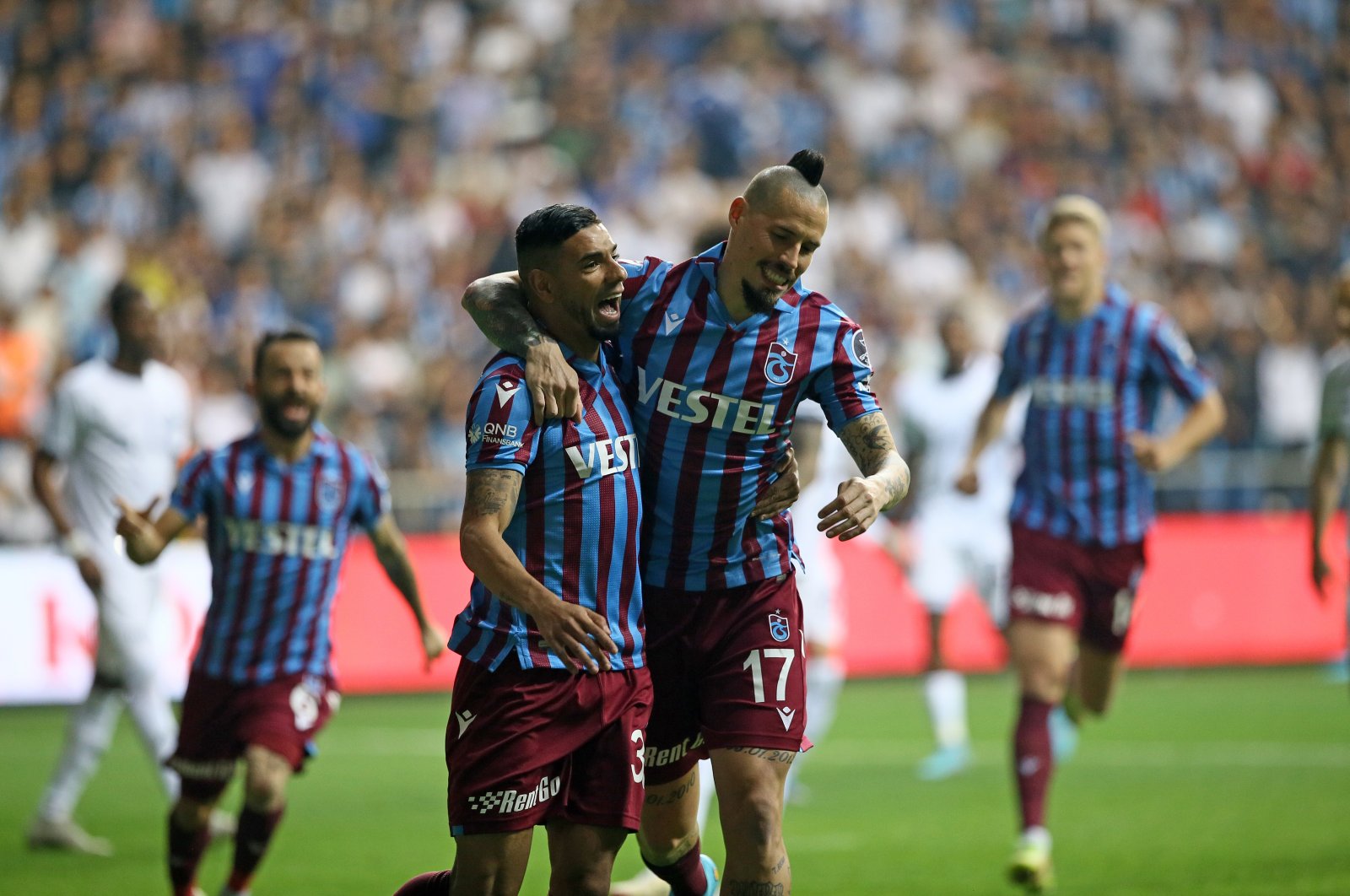 Trabzonspor&#039;s Bruno Peres (L) celebrates with teammate Marek Hamsik after scoring a goal in a Süper Lig match against Adana Demirspor, Adana, Turkey, April 23, 2022. (AA Photo)
