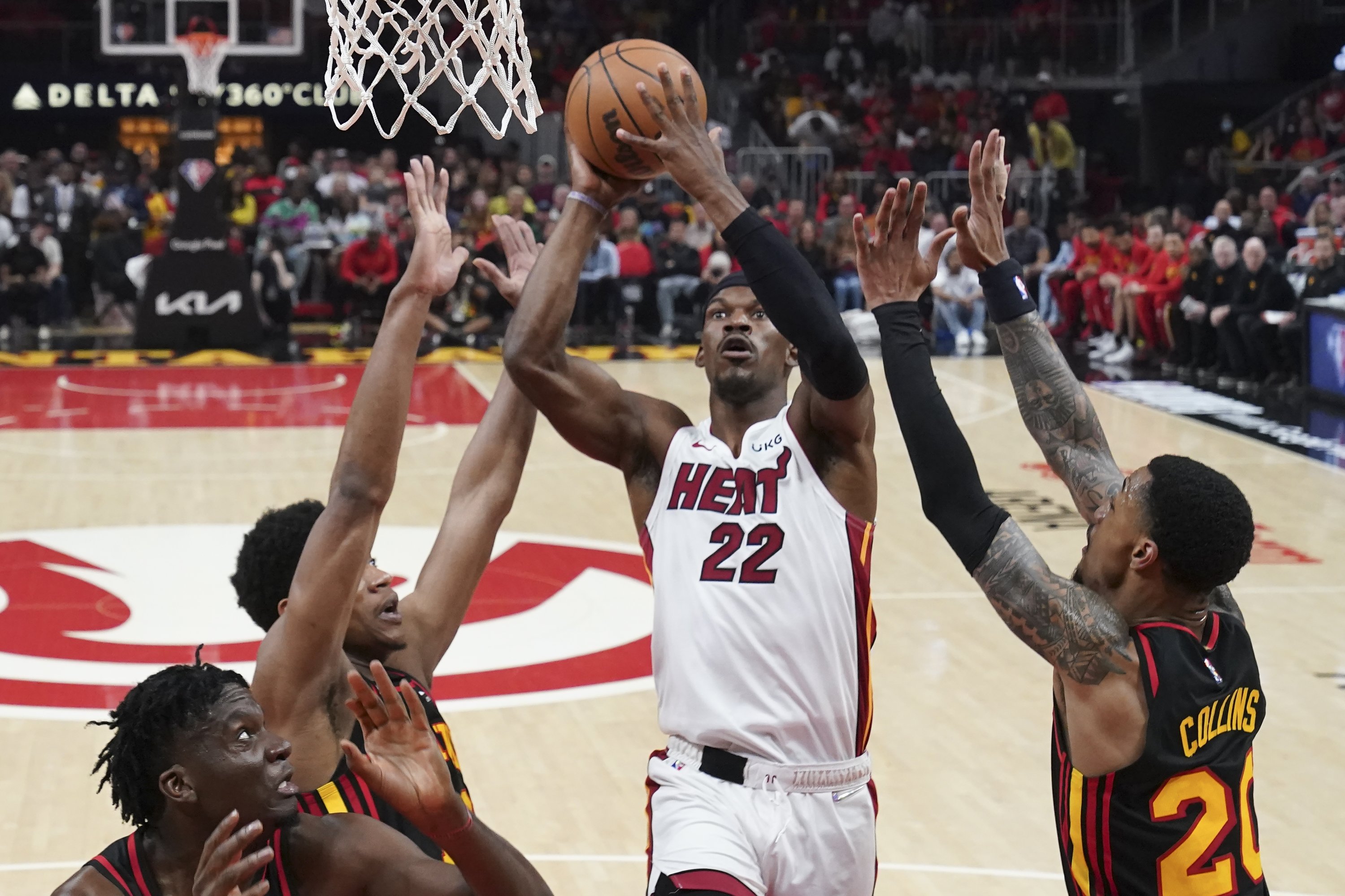 Heat forward Jimmy Butler (C) goes in for a basket in an NBA playoff game against the Hawks, Atlanta, U.S., April 24, 2022. (AP Photo)