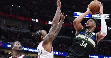 Bucks&#039; Giannis Antetokounmpo (R) shoots in an NBA playoff game against the Bulls, Chicago, U.S., April 24, 2022. (AP Photo)