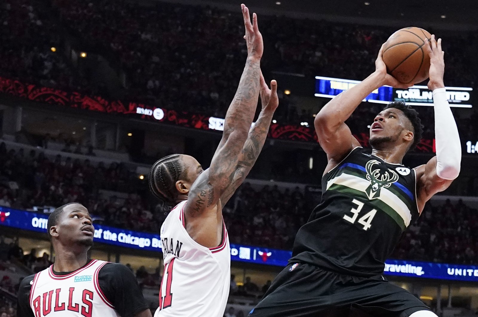 Bucks&#039; Giannis Antetokounmpo (R) shoots in an NBA playoff game against the Bulls, Chicago, U.S., April 24, 2022. (AP Photo)
