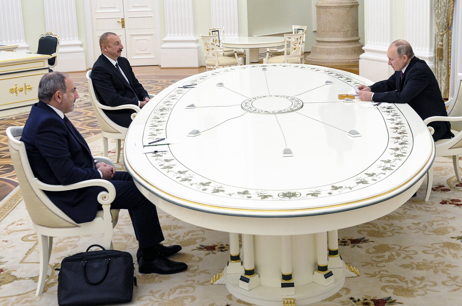 Russian President Vladimir Putin, right, attends talks with Azerbaijan&#039;s President Ilham Aliyev, second left, and Armenian Prime Minister Nikol Pashinian, left, at the Kremlin in Moscow, on Jan. 11, 2021. (AP)