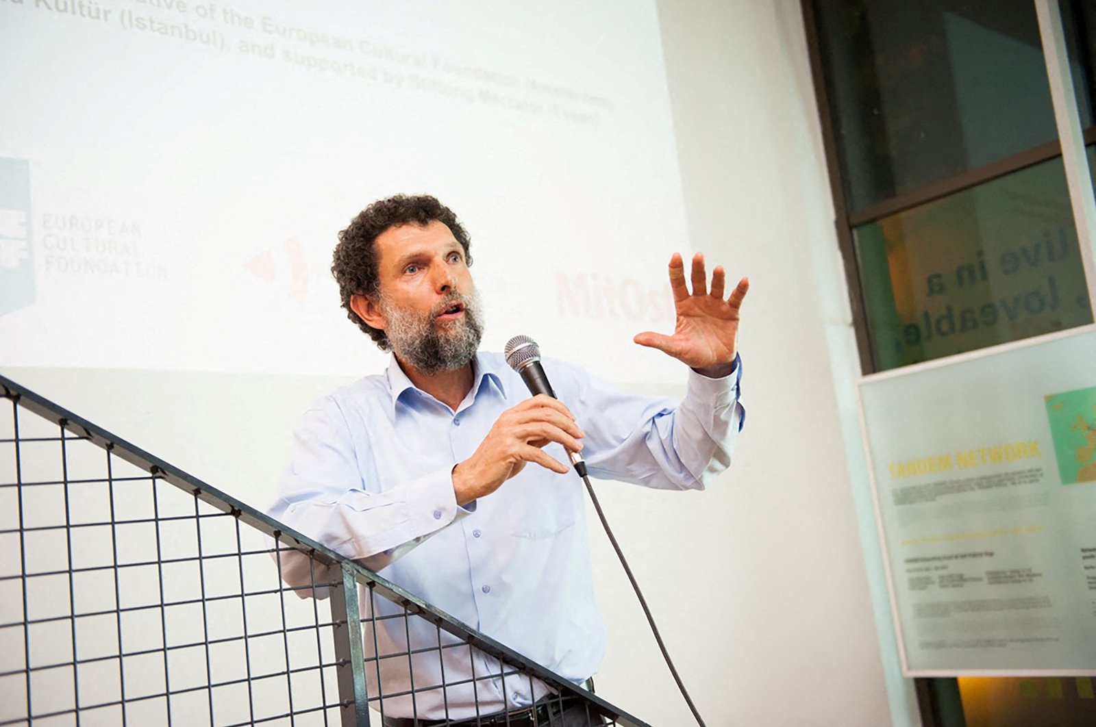 Turkish businessperson Osman Kavala speaks during an event in this undated handout photo. (Reuters Photo)