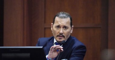 U.S. actor Johnny Depp testifies in the courtroom at the Fairfax County Circuit Courthouse in Fairfax, Virginia, U.S., April 25, 2022. (EPA)