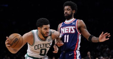 Celtics' Jayson Tatum (L) vies with Nets' Kyrie Irving in an NBA playoff game, New York, U.S., April 25, 2022. (AP Photo)