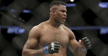 Francis Ngannou in action during a heavyweight championship MMA bout against Stipe Miocic at UFC 220, Boston, U.S., Jan. 21, 2018. (AP Photo)