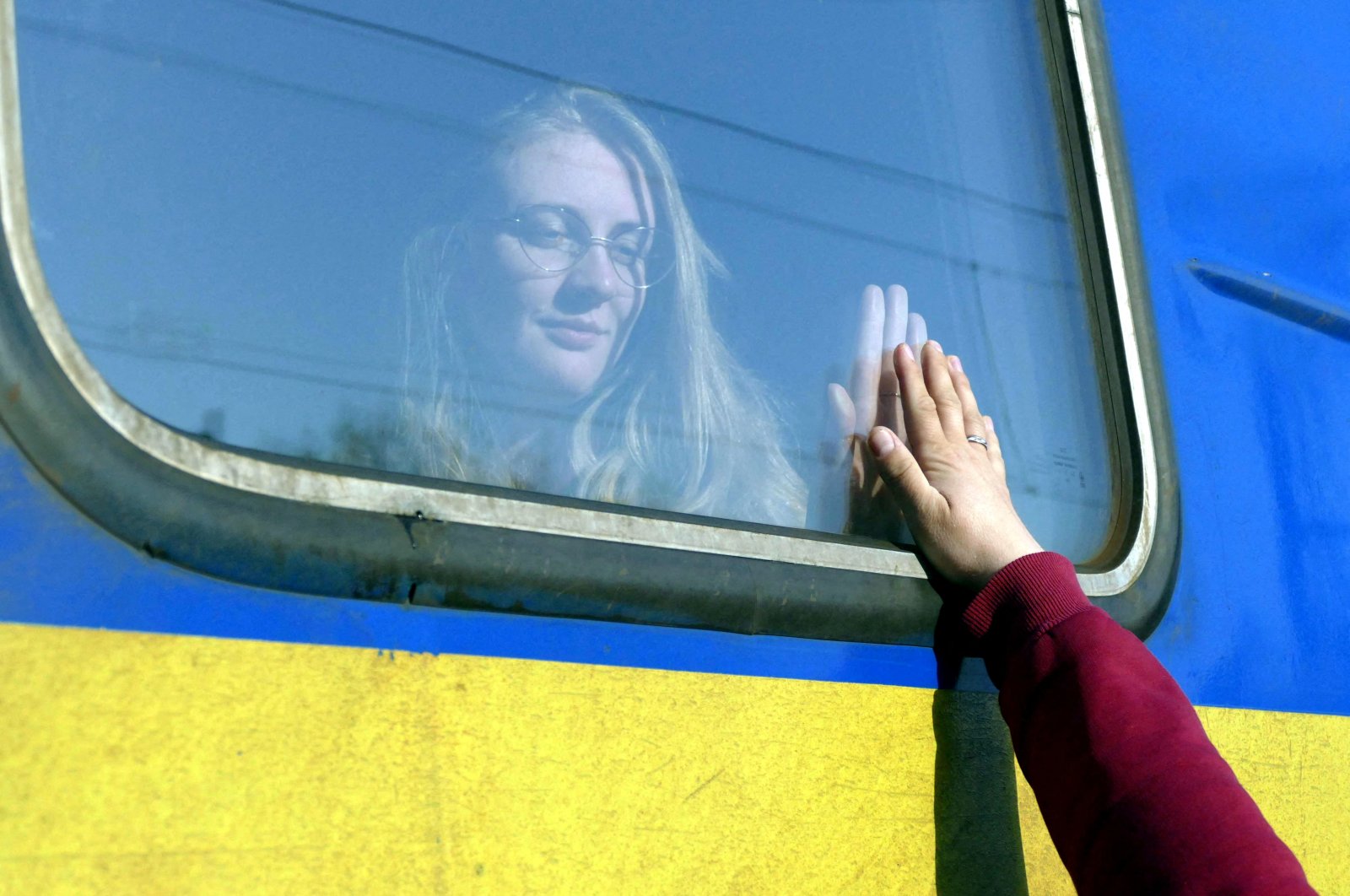 A woman says goodbye to her relative aboard a train traveling to Przemysl, Poland, amid Russia&#039;s invasion of Ukraine, in Odessa, Ukraine, April 25, 2022. (Reuters Photo)