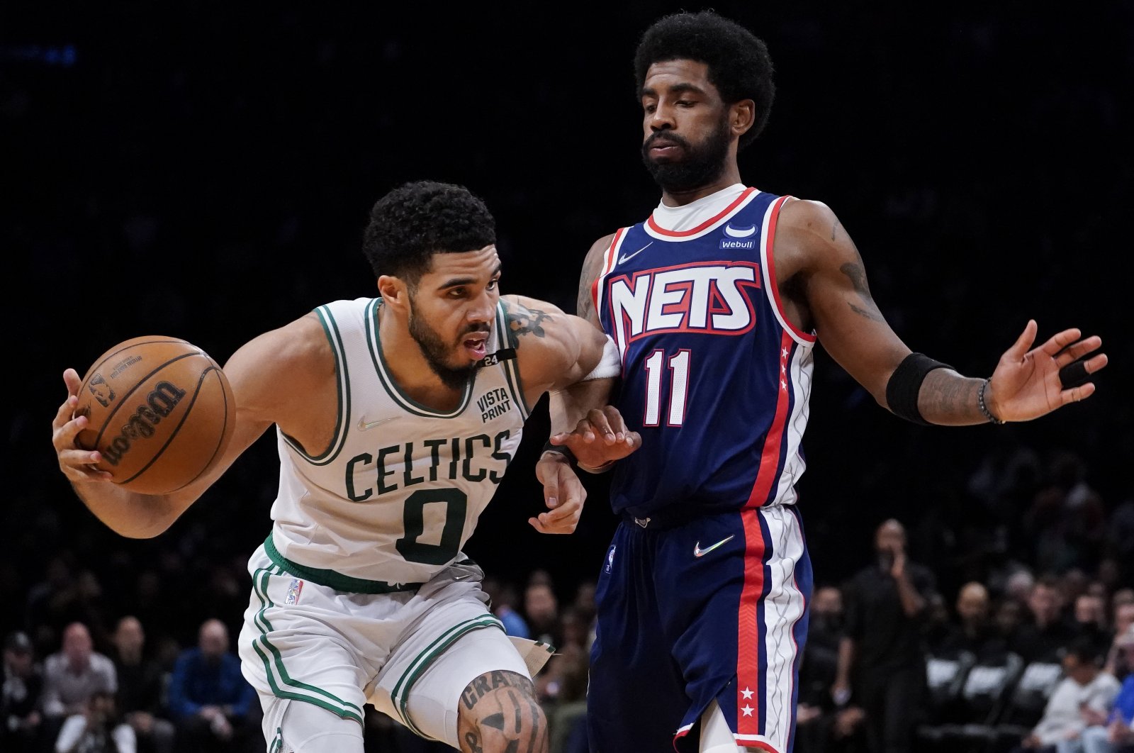 Celtics&#039; Jayson Tatum (L) vies with Nets&#039; Kyrie Irving in an NBA playoff game, New York, U.S., April 25, 2022. (AP Photo)