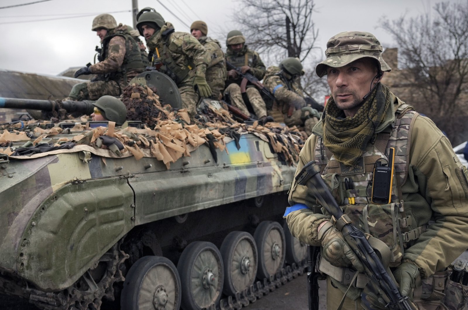 A Ukrainian officer walks alongside a tank, outside Kyiv, Ukraine, April 2, 2022. (AP Photo)