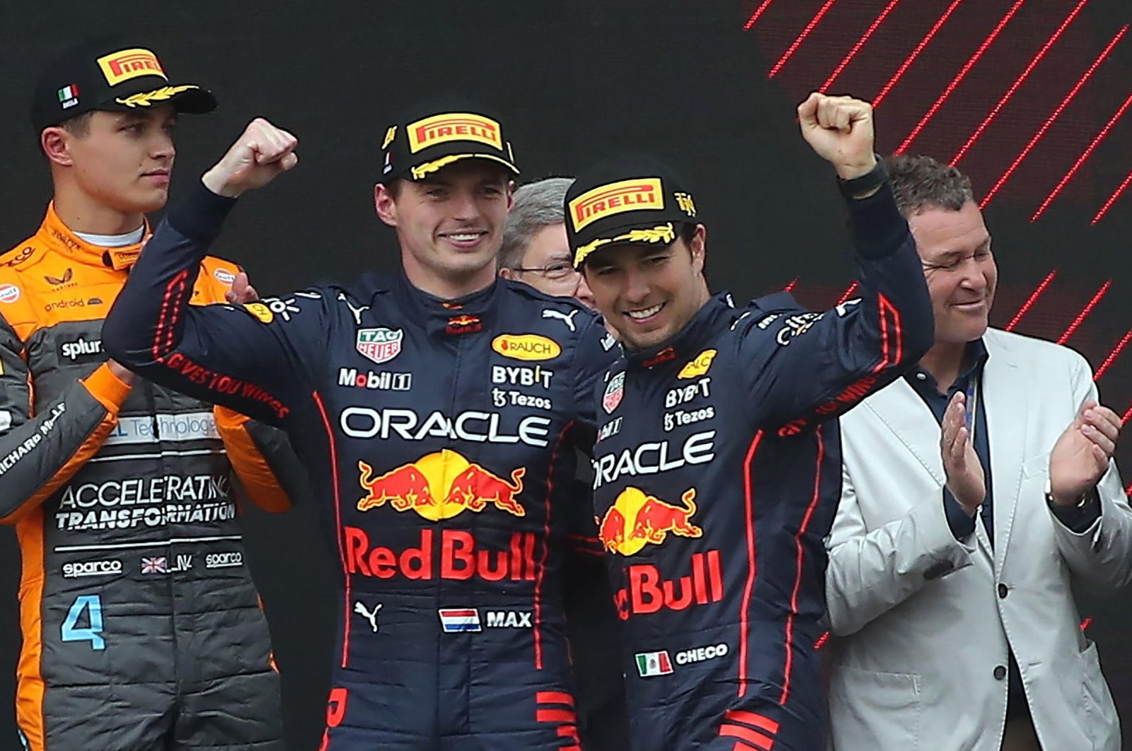 Red Bull drivers Max Verstappen (2nd L) and Sergio Perez celebrate on the podium for the F1 Emilia Romagna GP, Imola, Italy, April 24, 2022. (EPA Photo)