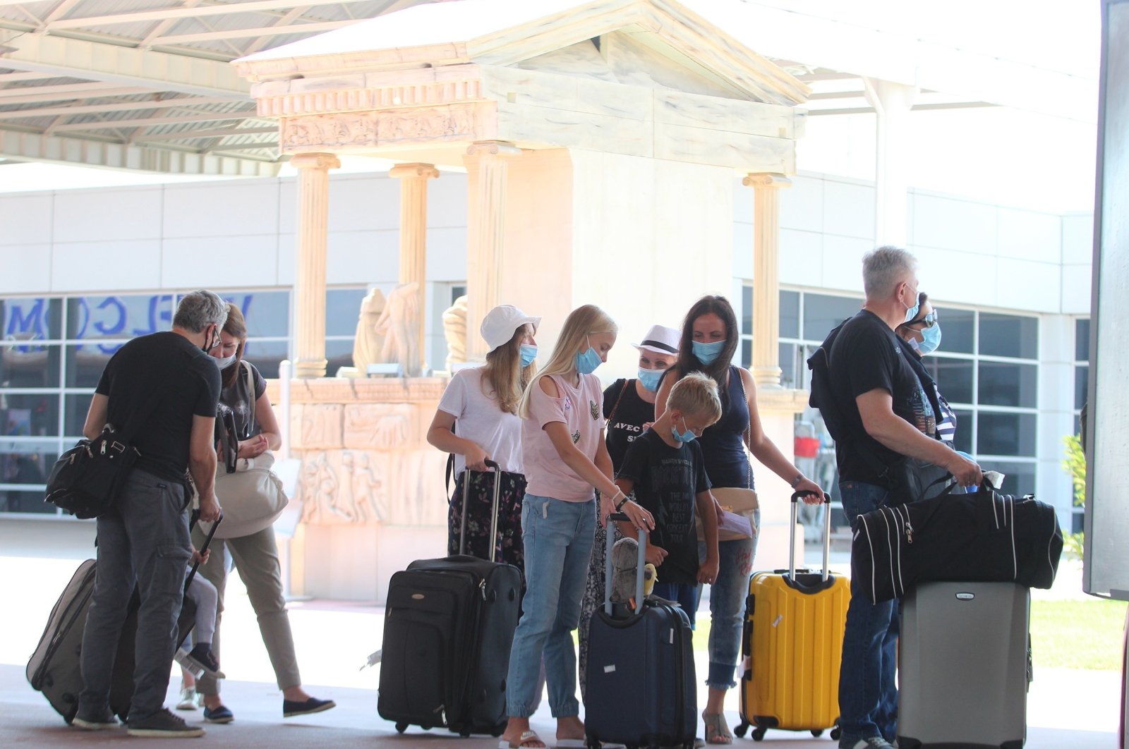 Russian tourists are seen at the Antalya Airport in Antalya, southern Turkey, Aug. 10, 2020. (IHA Photo)