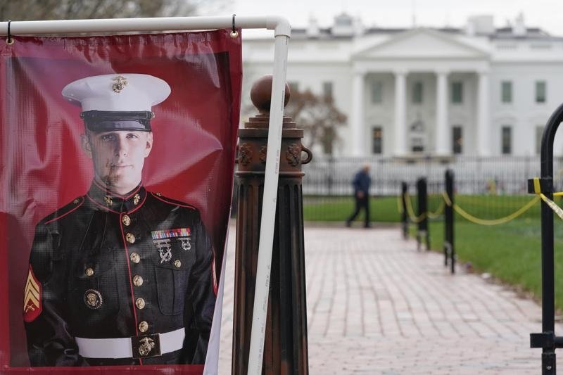 A poster photo of U.S. Marine Corps veteran and Russian prisoner Trevor Reed stands in Lafayette Park near the White House, U.S., March 30, 2022. (AP Photo)