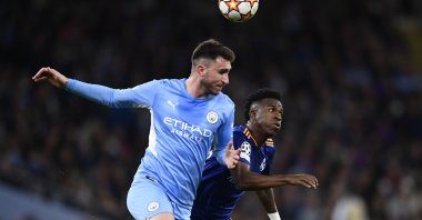Real's Vinicius Junior (R) vies with City's Aymeric Laporte (L) in a Champions League semifinal match, Manchester, England, April 26, 2022. (AA Photo)