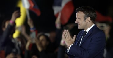 French President Emmanuel Macron gestures as he arrives to deliver a speech after being reelected as president, in Paris, France, April 24, 2022. (Reuters Photo)