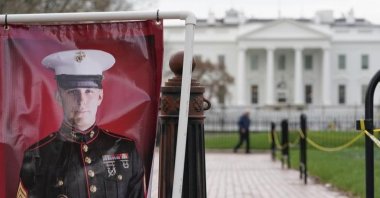 A poster photo of U.S. Marine Corps veteran and Russian prisoner Trevor Reed stands in Lafayette Park near the White House, U.S., March 30, 2022. (AP Photo)
