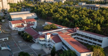 Aerial view of the new part of town with Stampar Makarije Elementary School and a pine tree park in the foreground, Podgorica, Montenegro, Sept. 3, 2018. (ShutterStock Photo)