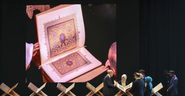A view of the mushaf on a screen as President Recep Tayyip Erdoğan examines the book on stage during the ceremony, in Istanbul, Turkey, April 27, 2022. (AA PHOTO)