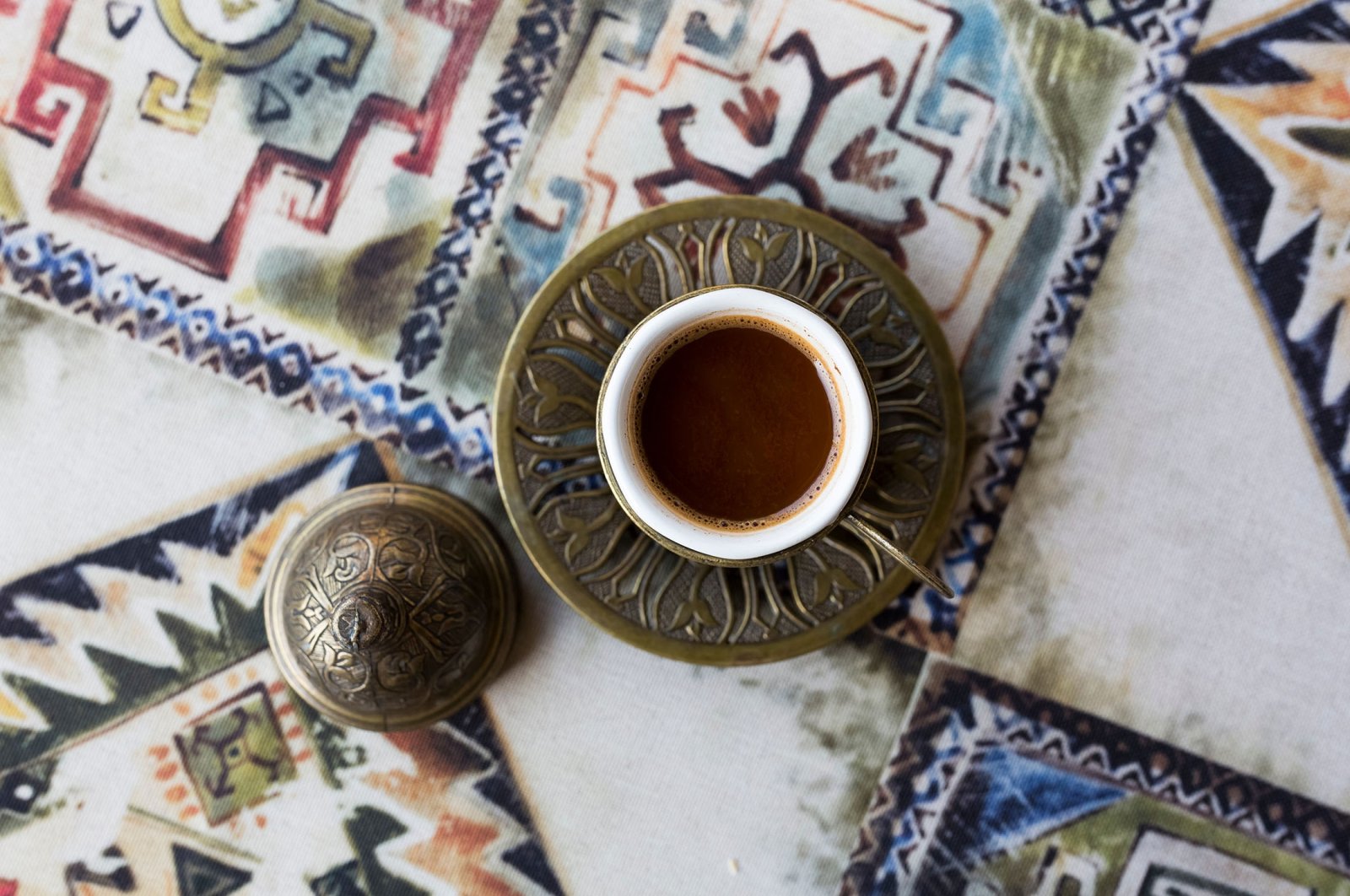 Traditional Turkish coffee rests on a table in a copper cup, in Tbilisi, Georgia. (Shutterstock Photo)