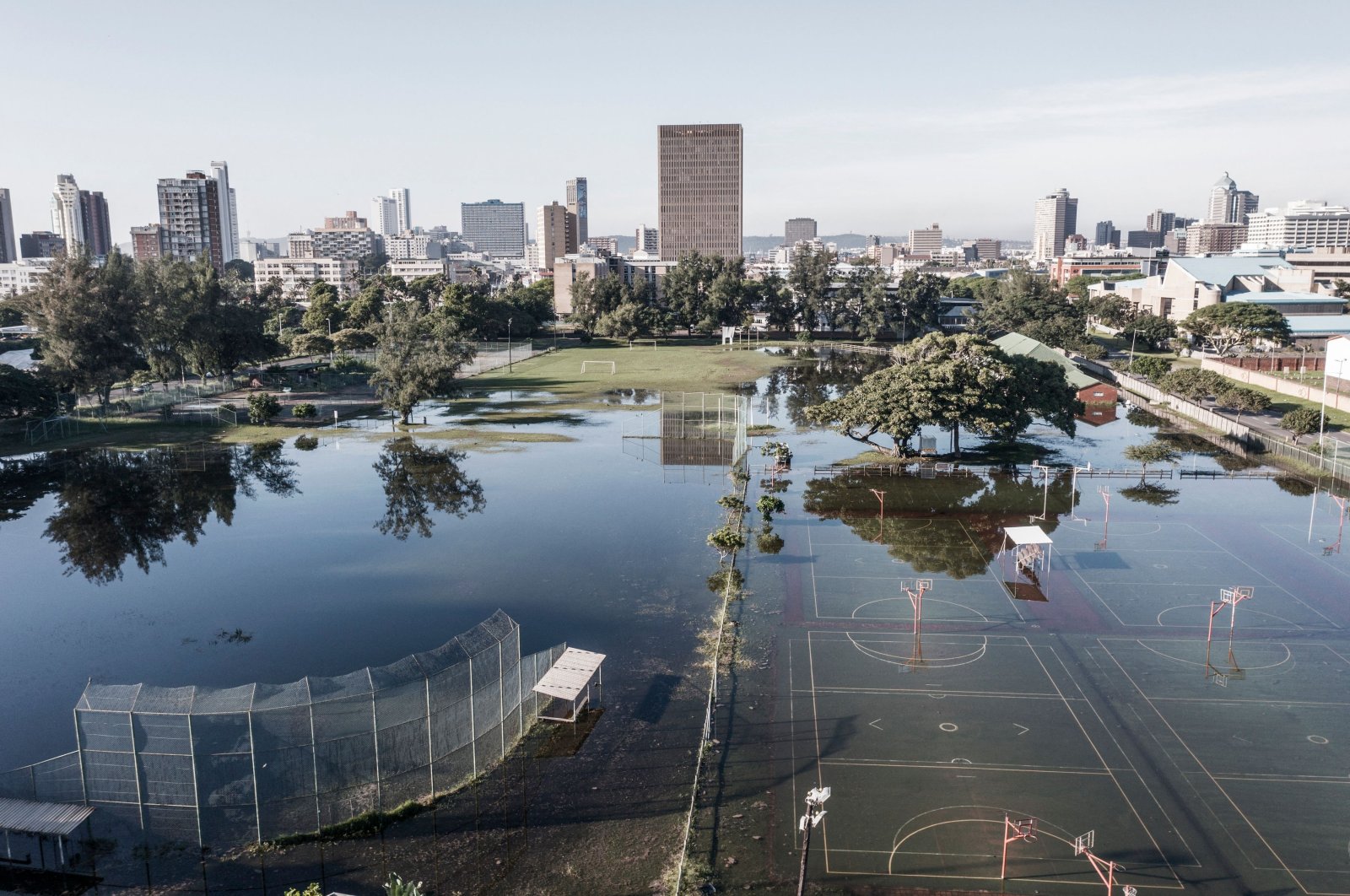 An aerial view shows sports fields under water days after heavy rains and &quot;unprecedented&quot; floods wreaked havoc in Durban, South Africa, April 15, 2022. (AFP Photo)