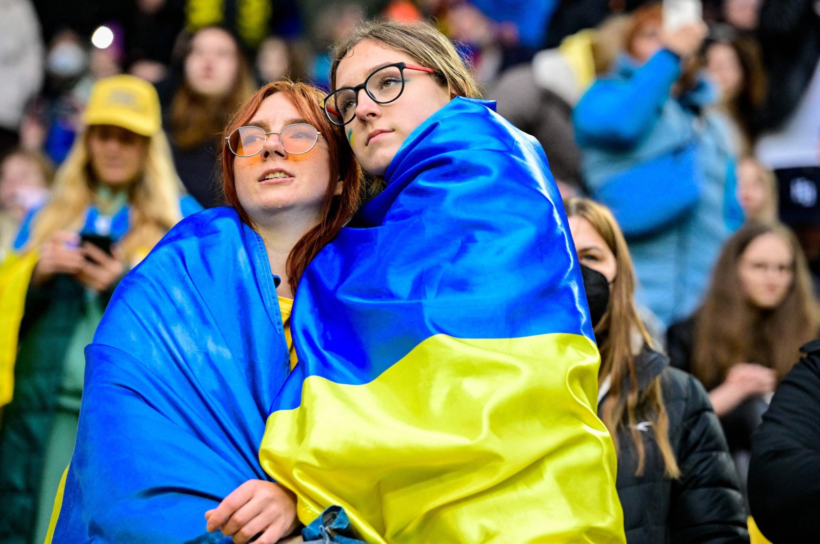 Fans draped in Ukraine flags attend a friendly football match between Borussia Dortmund and Dynamo Kyiv, Dortmund, Germany, April 26, 2022. (AFP Photo)