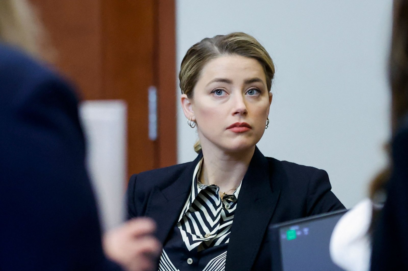 Actor Amber Heard arrives for her ex-husband Johnny Depp&#039;s defamation trial against her at the Fairfax County Circuit Courthouse in Fairfax, Virginia, April 27, 2022. (AFP Photo)