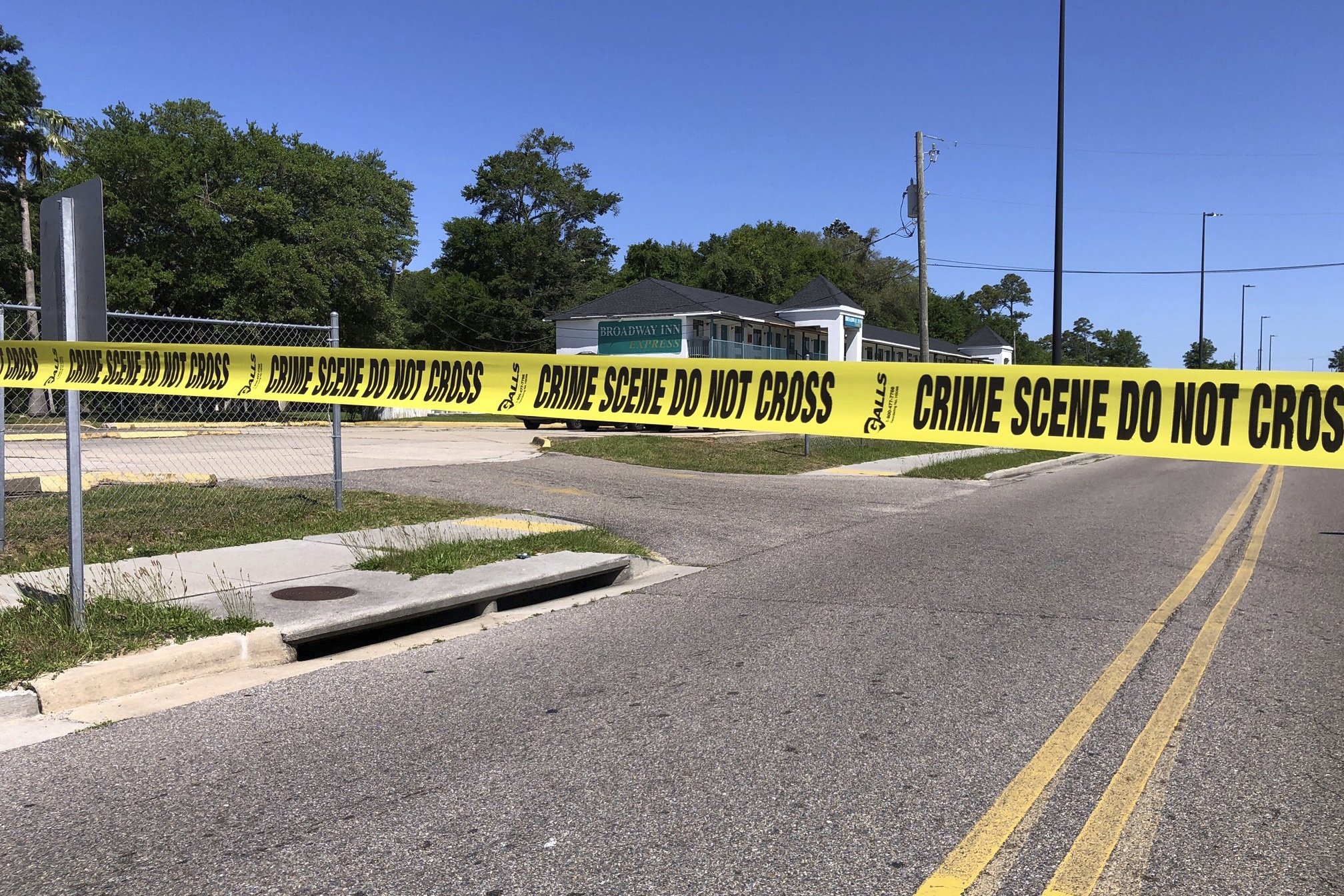Police at the crime scene tape sections off the area surrounding the Biloxi Broadway Inn Express, Biloxi, Miss., U.S., April 27, 2022. (Photo via AP)